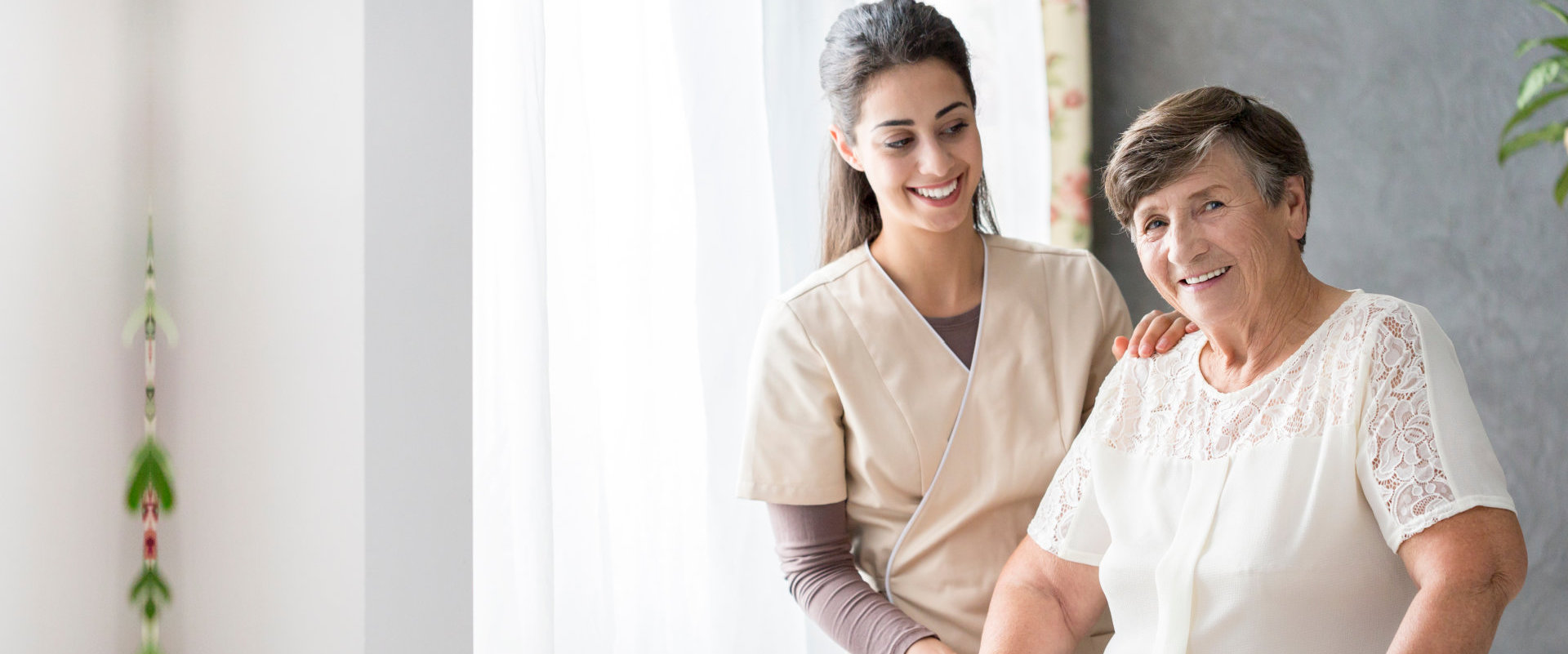 a female caregiver with an elderly woman