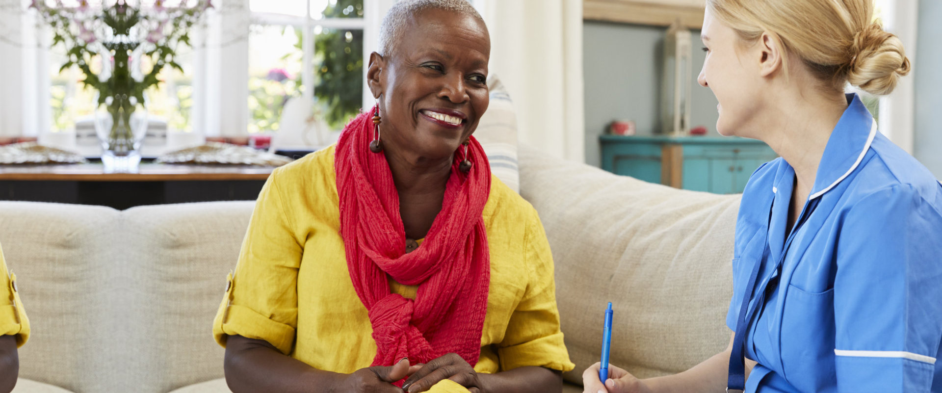 a female caregiver interviewing an elderly woman