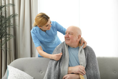 a female caregiver with an elderly man